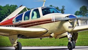 single propeller lightweight aircraft on a runway