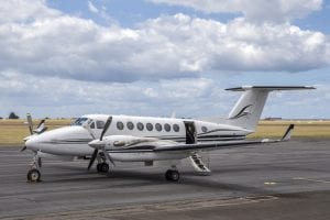 twin propeller light passenger aircraft on a runway