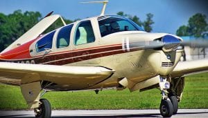 single propeller light aircraft on the runway